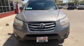 Front view of a silver Hyundai SUV parked in a dealership lot, with a Wheel City Auto Finance Centers license plate frame visible on the front bumper.