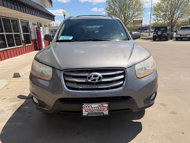 Front view of a silver Hyundai SUV parked in a dealership lot, with a Wheel City Auto Finance Centers license plate frame visible on the front bumper.