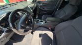 Front interior of a Chevrolet SUV showing the steering wheel, dashboard, and center console from the driver's seat perspective.