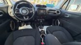Interior of a car showing the steering wheel, dashboard, and center console between the front seats.]','Interior cockpit view of a compact SUV with steering wheel, touchscreen, gear shift, and front seats.','Front cabin of a vehicle parked outside, featuring the steering wheel and front seating area.