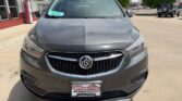 Front view of a metallic gray Buick SUV parked in a lot, with a Wheel City Auto Finance Centers license plate frame.