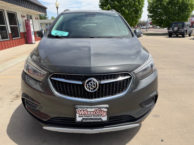 Front view of a metallic gray Buick SUV parked in a lot, with a Wheel City Auto Finance Centers license plate frame.