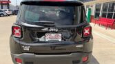 Rear view of a black Jeep SUV in a dealership lot; Jeep emblem, 4x4 badge, and Wheel City license plate frame visible.
