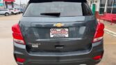 Gray Chevrolet Trax AWD, rear view, parked at a dealership with Wheel City Auto Finance Centers license plate frame visible.