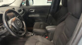 Inside a black car showing the front seats, steering wheel, and center console from the passenger side view