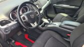 Interior of a car showcasing the steering wheel, dashboard, and center console with gear shifter