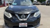 Front view of a dark blue Nissan SUV at a dealership, with a WheelCity Auto Finance Centers plate frame and a windshield sticker visible.