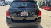 Rear view of a black Chevrolet Trax LT SUV at a car dealership, with Wheel City Auto Finance Centers license plate frame.