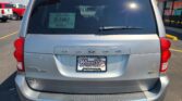 Rear view of a silver Dodge Durango at a car dealership with Wheel City license-plate frame.