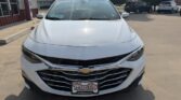 Front view of a white Chevrolet SUV or crossover parked at a dealership lot, showing the chrome grille and Chevrolet emblem with a Wheel City license plate frame.