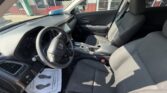 Interior of a Honda sedan’s front cabin with steering wheel, dashboard, and center console visible from the driver’s sideillustration of a clean gray fabric interior.